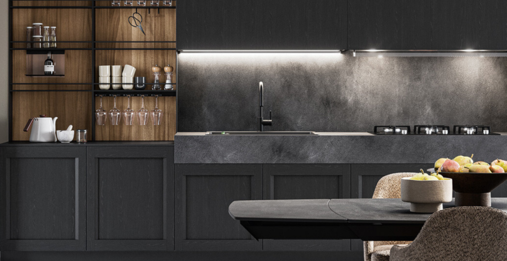 Cucina moderna con mobili scuri, piano in pietra grigia e mensole in legno, tavolo da pranzo e lavello di design.