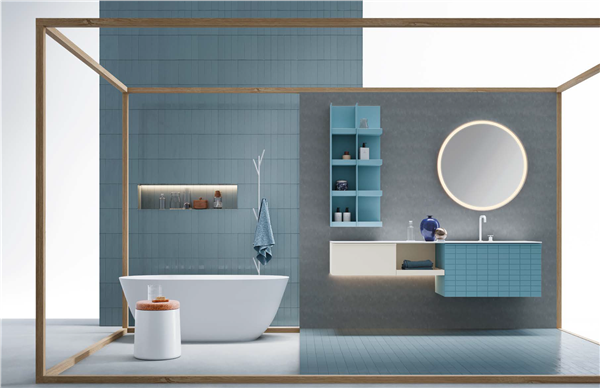 Ambientazione bagno con rivestimenti azzurri, vasca freestanding e mobile sospeso