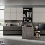 Cucina con isola e parete attrezzata living integrata in un unico ambiente