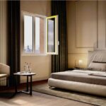 Camera da letto con finestra in legno alluminio, poltrona e tende