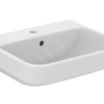 Lavabo bianco rettangolare a bordi arrotondati su fondo chiaro