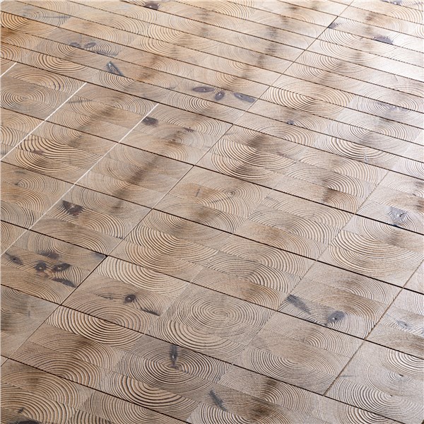 Pavimento in legno con doghe decorate a motivi incisi circolari