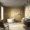 Bagno moderno con marmo della Ceramica Del Conca, vasca rotonda bianca, doppio lavabo blu e mobili in legno scuro.